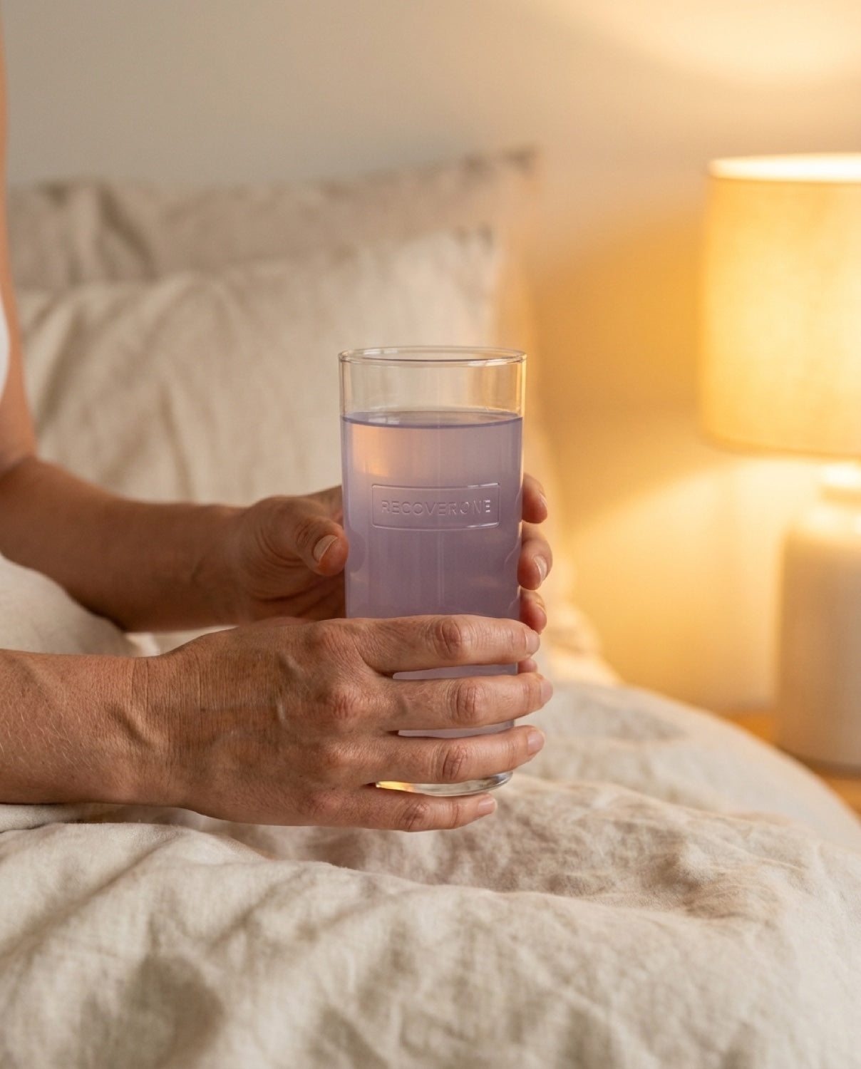 Hands holding glass